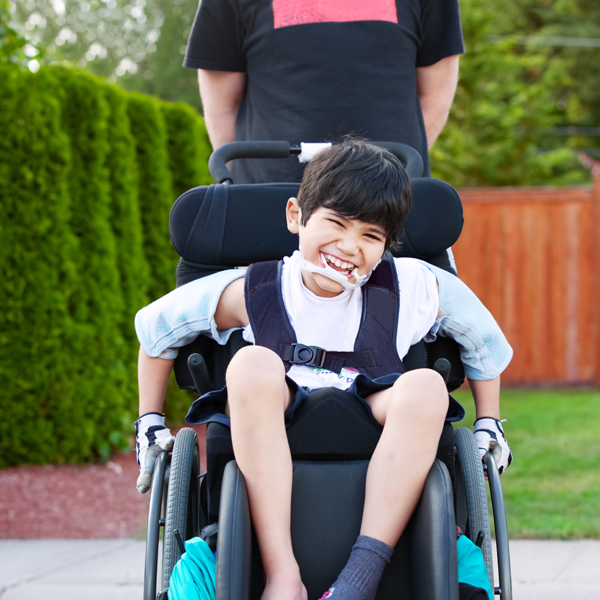 Boy in wheelchair smiling