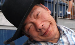 Man in cowboy hat smiling