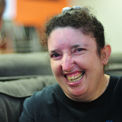 Woman in dark hair smiling